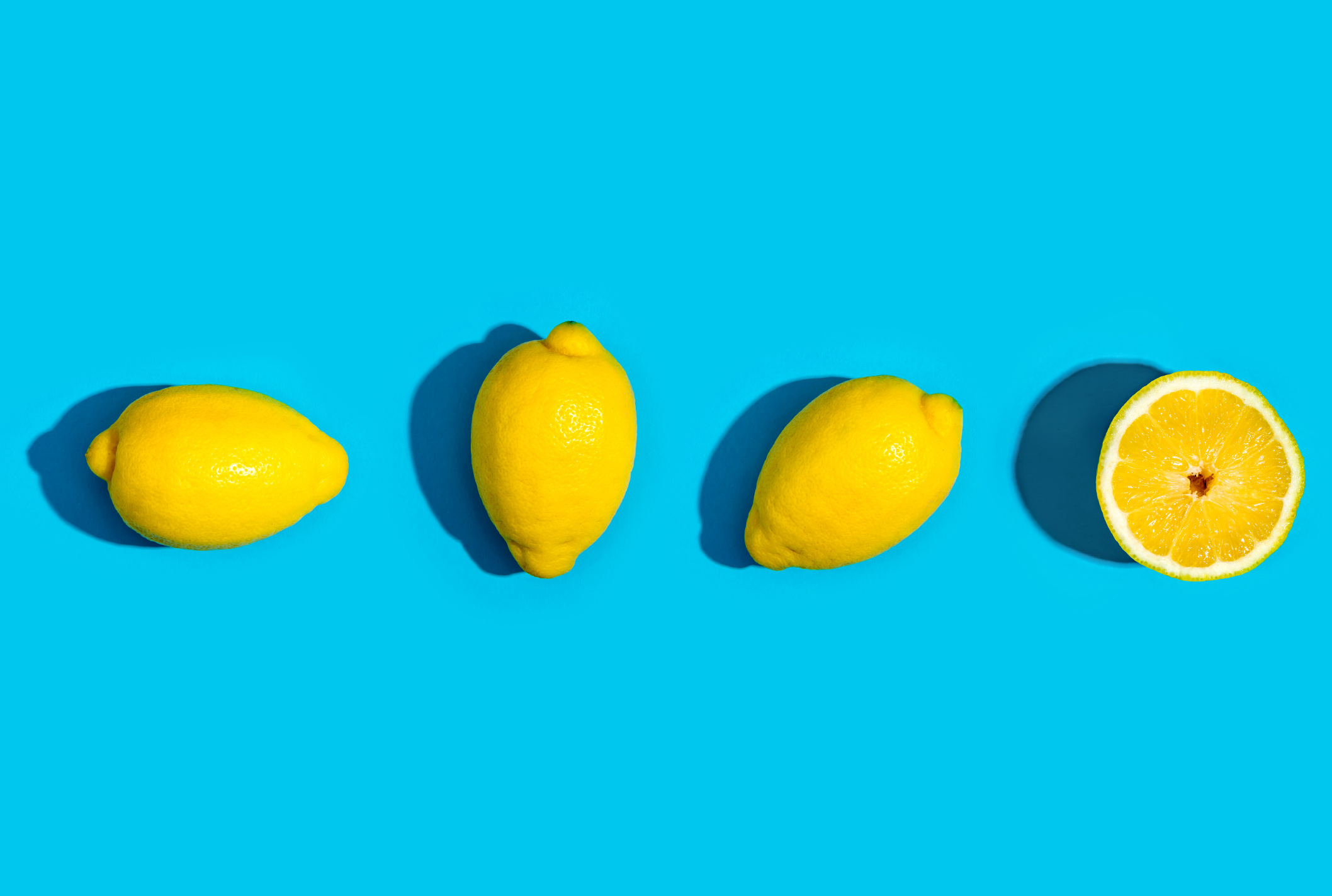 Fresh Lemons on blue background